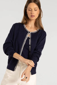 Navy blue knit pippa cardigan with white checkered trim along neckline and front opening by thread & supply