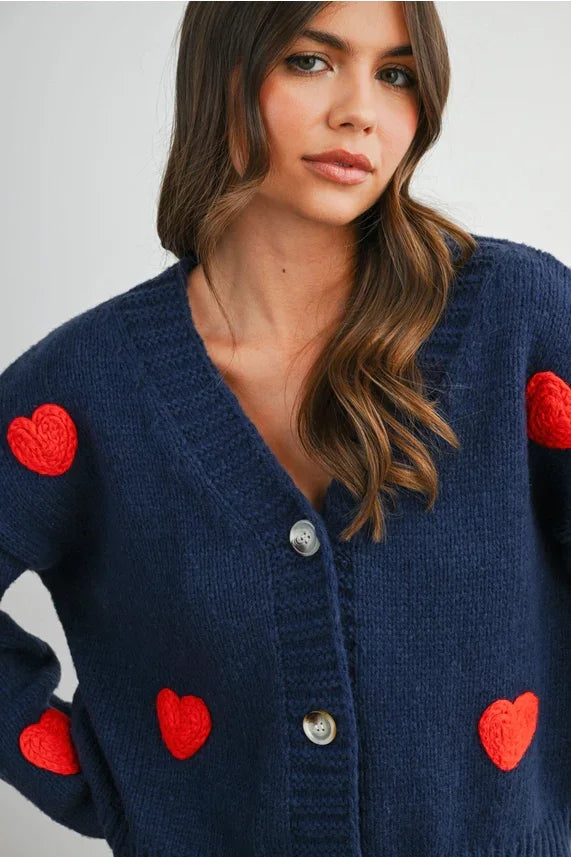 Navy blue heart pattern cropped V neck cardigan with red patches and silver buttons