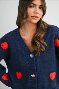 Navy blue heart pattern cropped V neck cardigan with red patches and silver buttons
