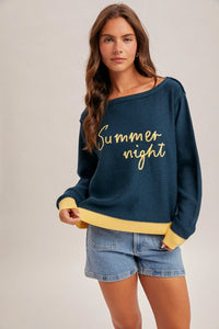 Summer night graphic sweater: navy off-shoulder knit with gold text