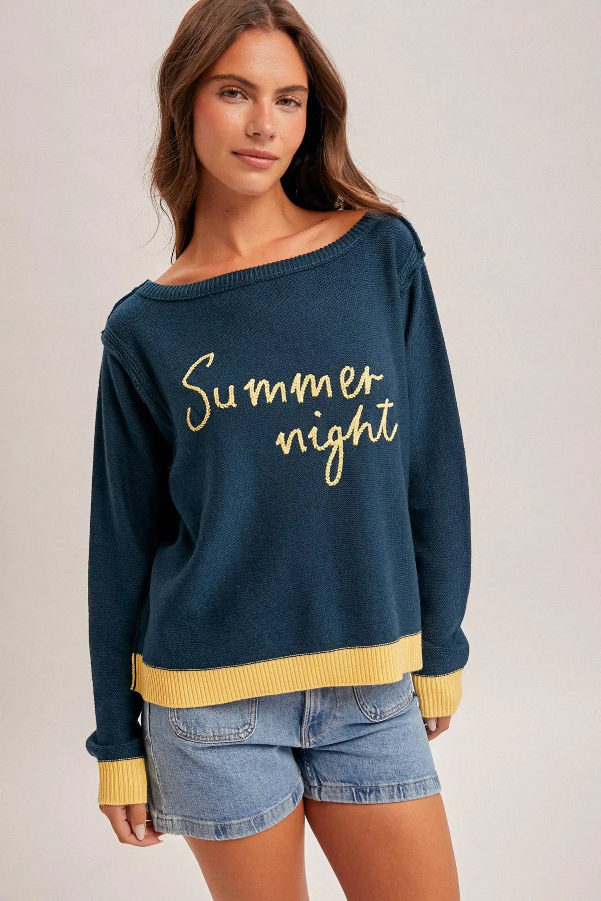 Summer night graphic sweater: navy off-shoulder knit with gold text