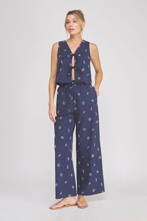 Navy blue seashell lace embroidered sleeveless v-neck top with tie-front and matching wide-leg pants two-piece set