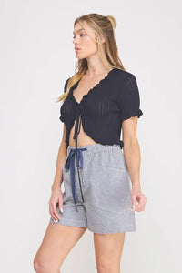 Navy blue pointelle knit ruffle tie short sleeve bolero tie top with ribbed texture and cropped fit