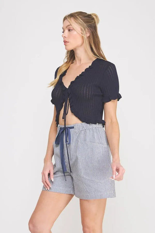 Navy blue pointelle knit ruffle tie short sleeve bolero tie top with ribbed texture and cropped fit