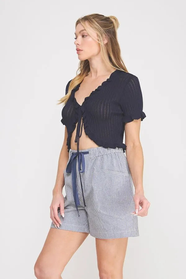 Navy blue pointelle knit ruffle tie short sleeve bolero tie top with ribbed texture and cropped fit
