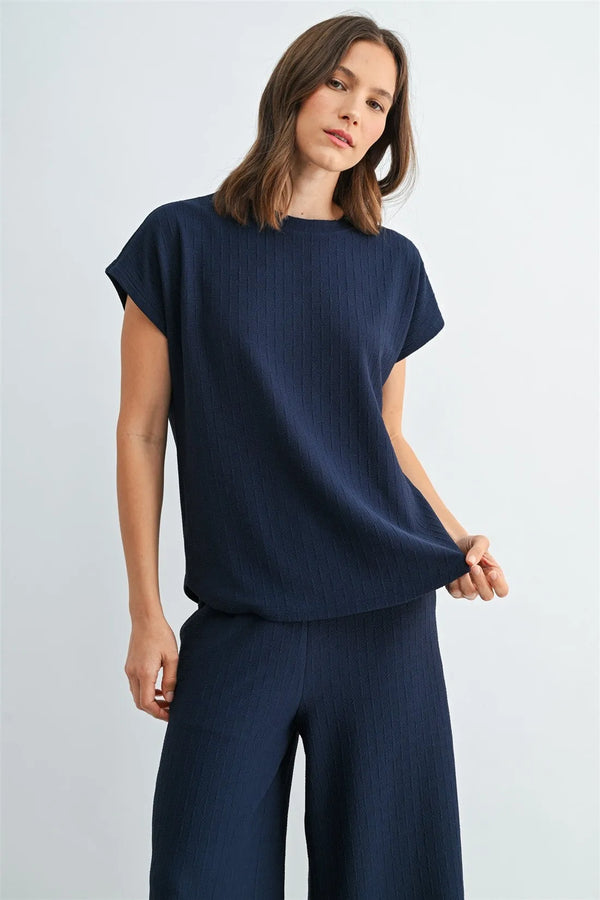 Navy blue textured knit dolman top with short sleeves featuring a ribbed knit pattern for casual wear