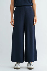 Navy blue textured knit elastic waist ribbed wide-leg trousers showcasing knit elastic waist detail