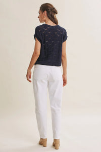 Navy blue short-sleeved harbor cable knit cotton sweater top with textured diamond-patterned design