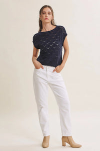 Navy blue short-sleeved harbor cable knit cotton sweater top with textured diamond-patterned design