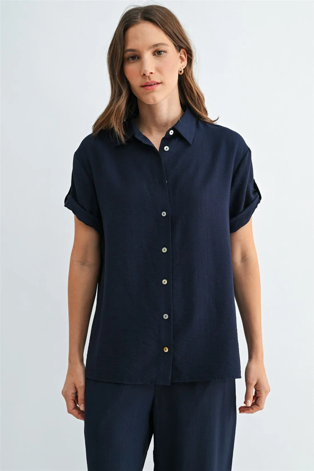 Navy blue short sleeve button down shirt with rolled cuffs and silver sleeve buttons ideal for casual wear