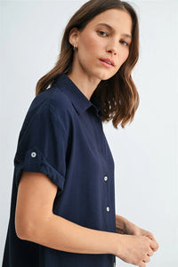 Navy blue roll up short sleeve button shirt with white buttons and rolled cuffs for casual wear