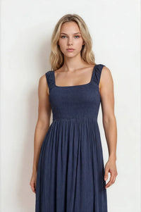 Navy blue crinkle plisse smocked midi dress with cap sleeve smocked ruffled straps and pleated skirt design