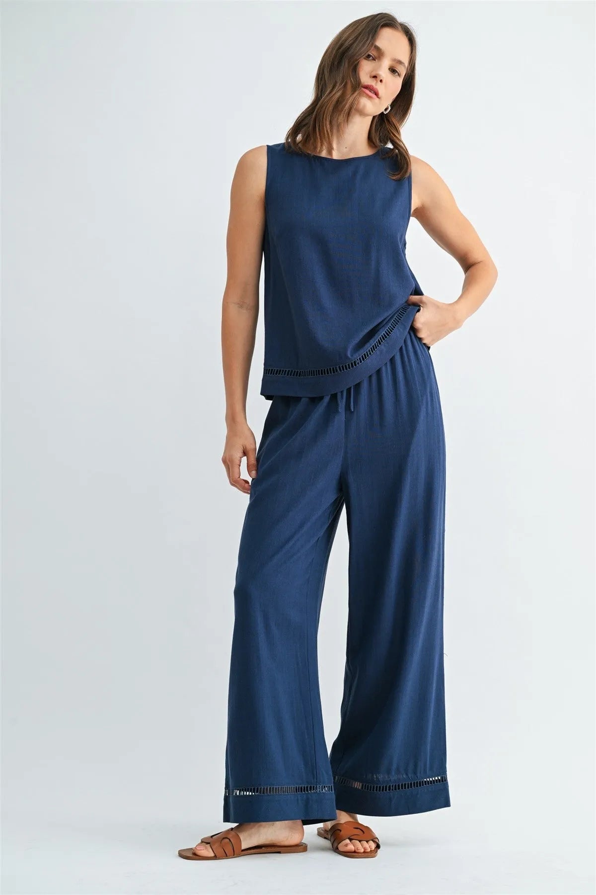 Navy blue sleeveless top with subtle textured hem detail paired with drawstring trim pants in women’s boho chic clothing from shop daisy