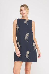 Navy blue sleeveless mini dress featuring delicate white palm tree embroidered detailing for elegant wear