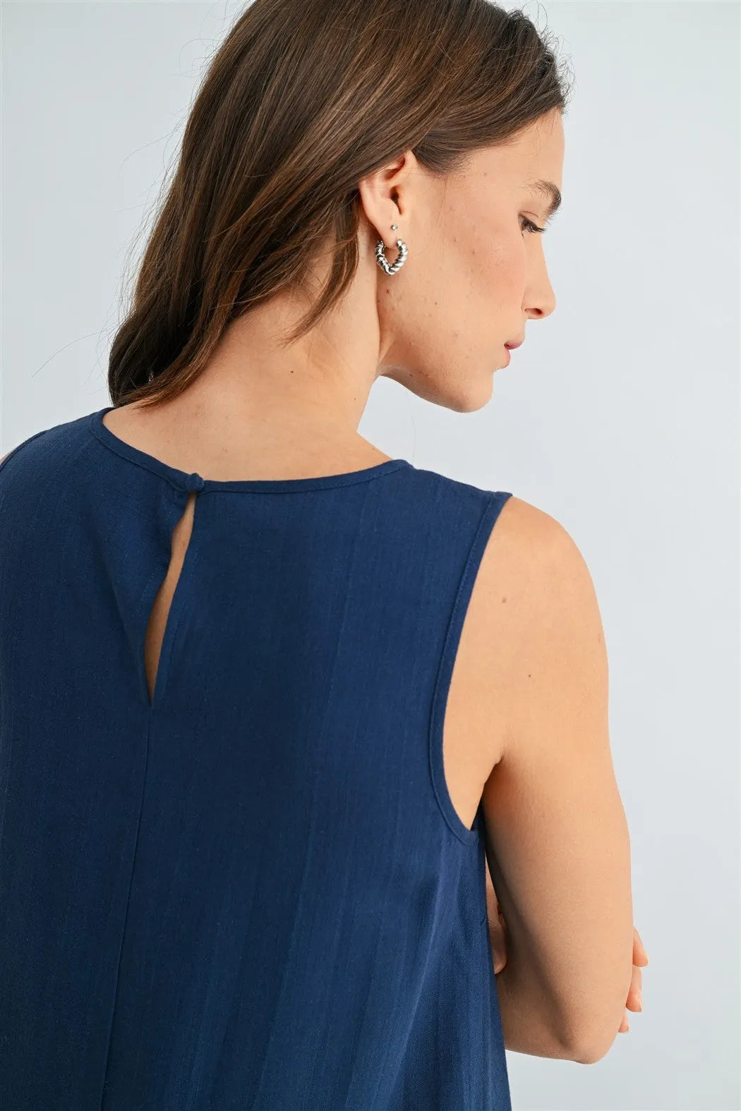 Navy blue sleeveless dress with round neck trim and keyhole back detail in a round neck trim tank style