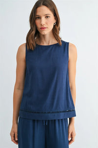 Navy blue sleeveless round neck tank with subtle textured fabric and decorative fringe trim along the hem