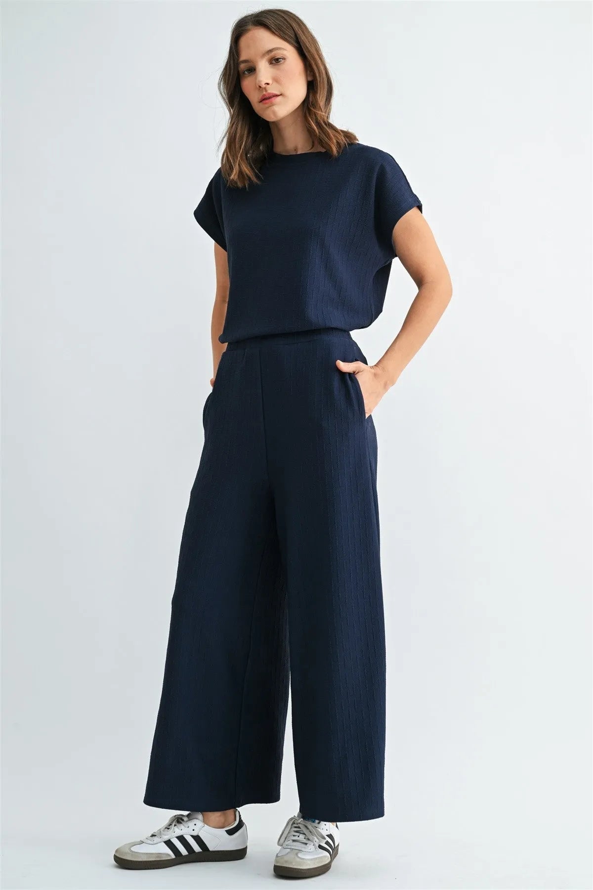 Navy blue textured knit wide-leg pants complementing the textured knit dolman top for stylish knit dolman wear