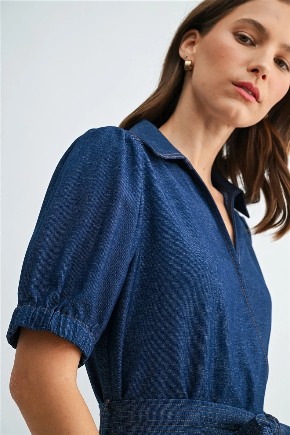 Navy blue textured fabric short sleeve wrap dress with collar and cinched tie waist for elegant wear