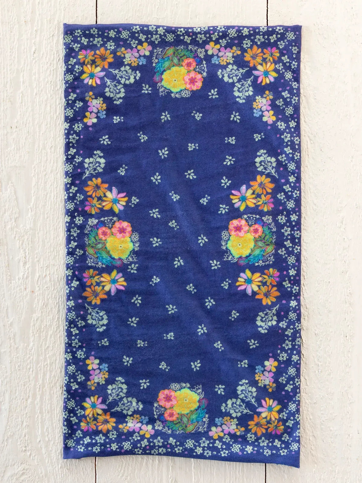 A navy blue full boho bandeau headband with vibrant yellow, pink, orange, and white floral patterns tropic bandana navy