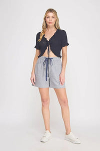 Navy blue and white striped high waisted shorts with a drawstring waistband in pointelle knit ruffle tie style
