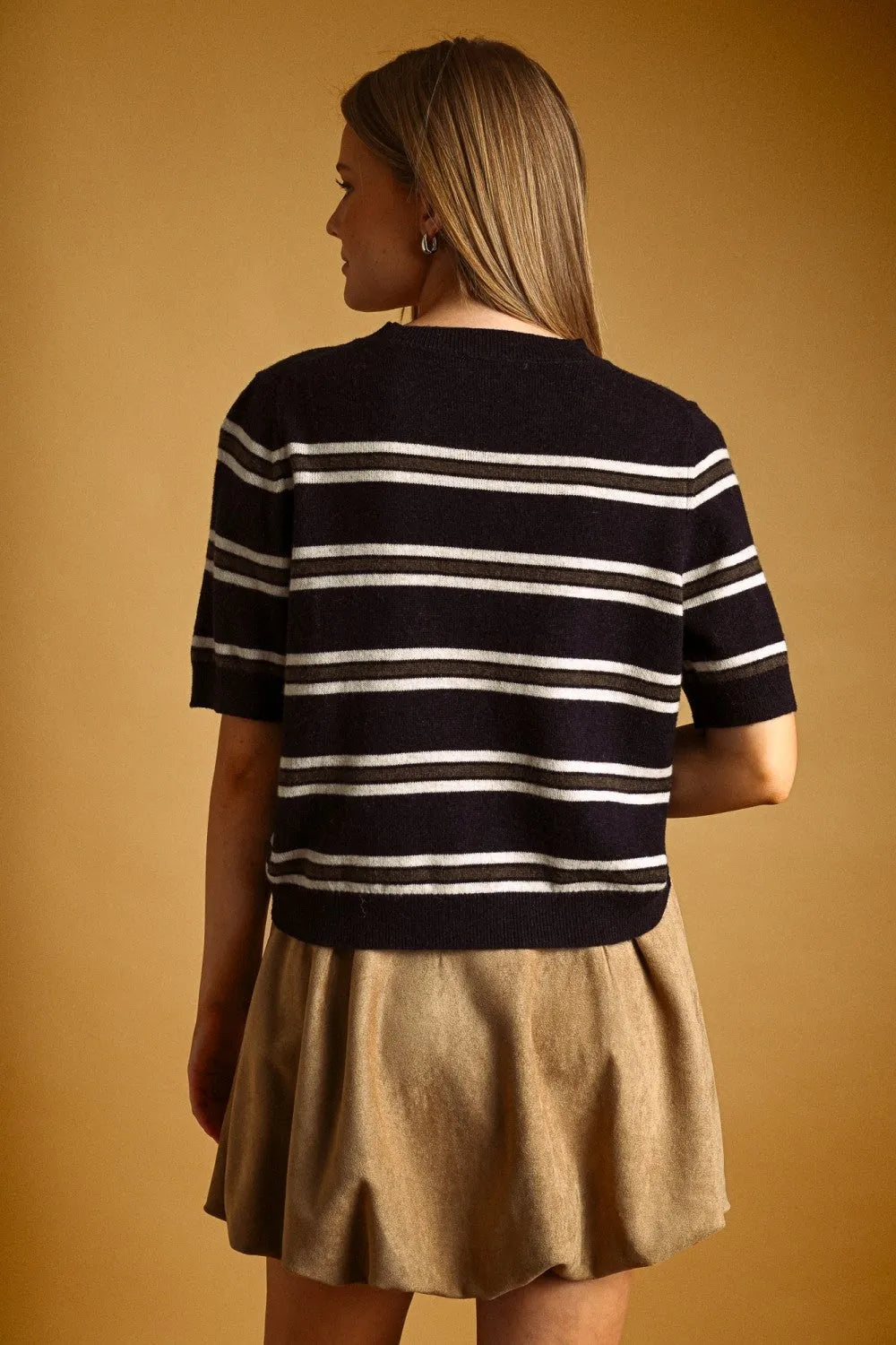 Navy blue and white stripe pattern short sleeve knit top with ribbed neckline and hem in a lightweight fabric