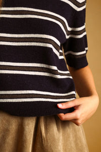 A navy blue white and dark gray stripe pattern short sleeve knit top with horizontal stripes and a soft knit fabric