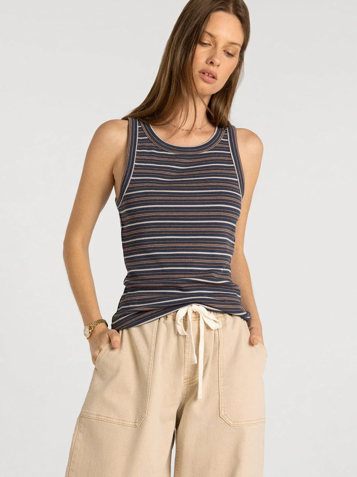 A navy blue and white striped ribbed tank top with thin straps in the thread and supply edlin basic tank collection