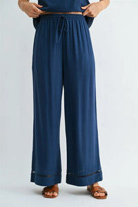 Navy blue drawstring trim detail pants for women featuring wide legs elastic waistband and lace trim at hem from shop daisy