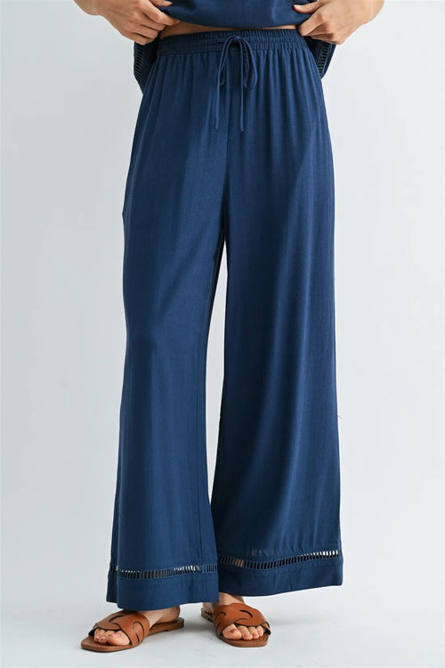 Navy blue wide-leg drawstring trim pants with fringe hem for women’s boho chic clothing shop daisy collection