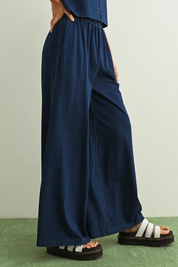 Navy blue wash knitted pants with elastic waistband and wide-leg silhouette