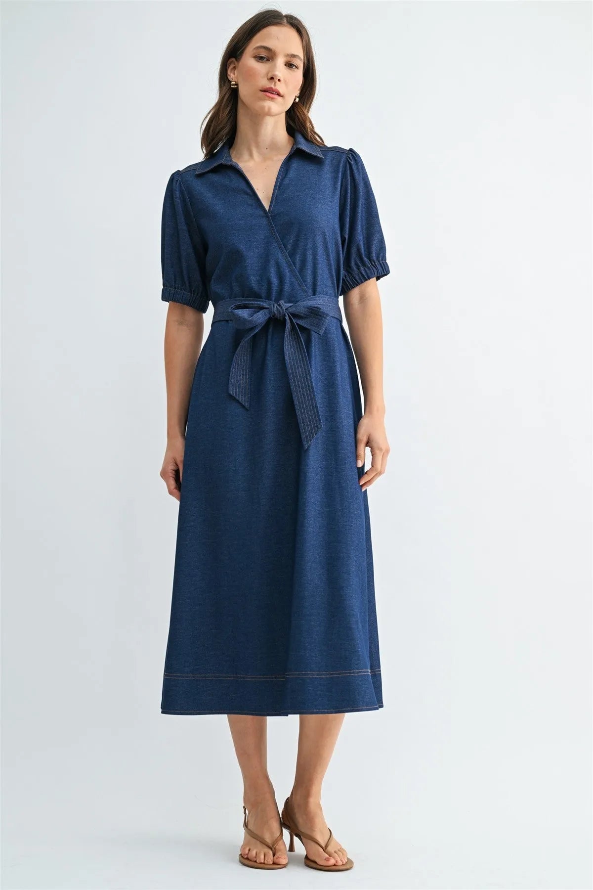 Navy blue short sleeve wrap dress with puffed sleeves and tie waist belt for elegant casual wear
