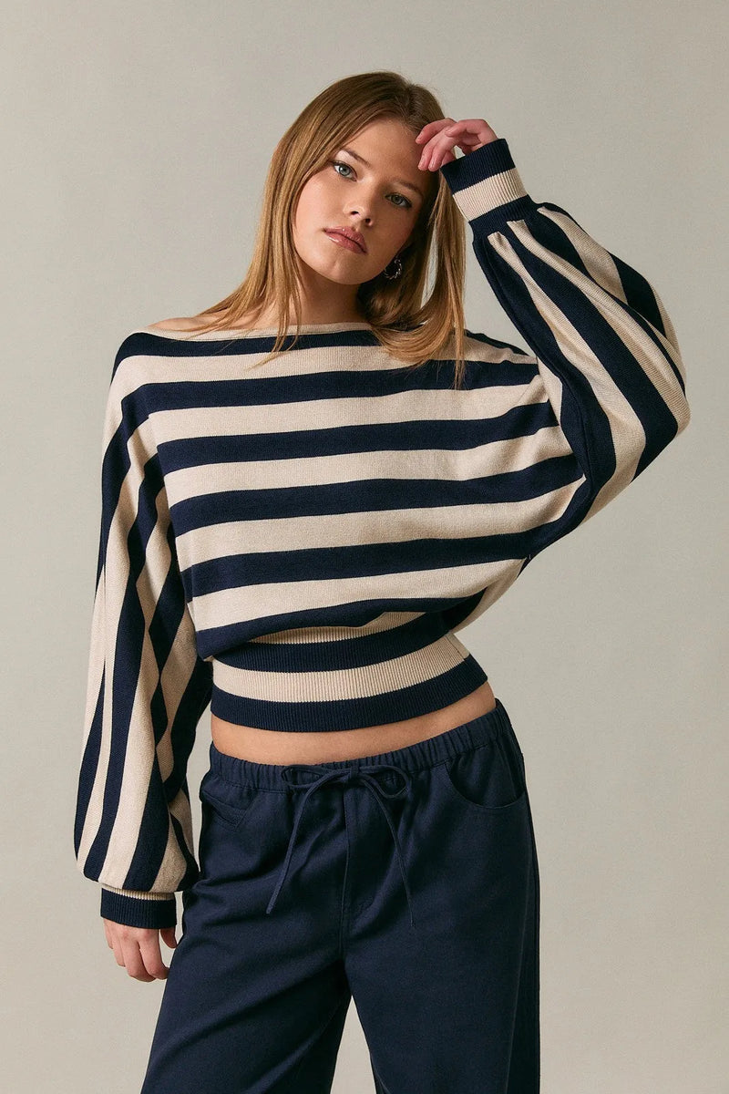 Boat neck dolman sleeve sweater top in navy and cream striped knit with voluminous sleeves and cropped fit