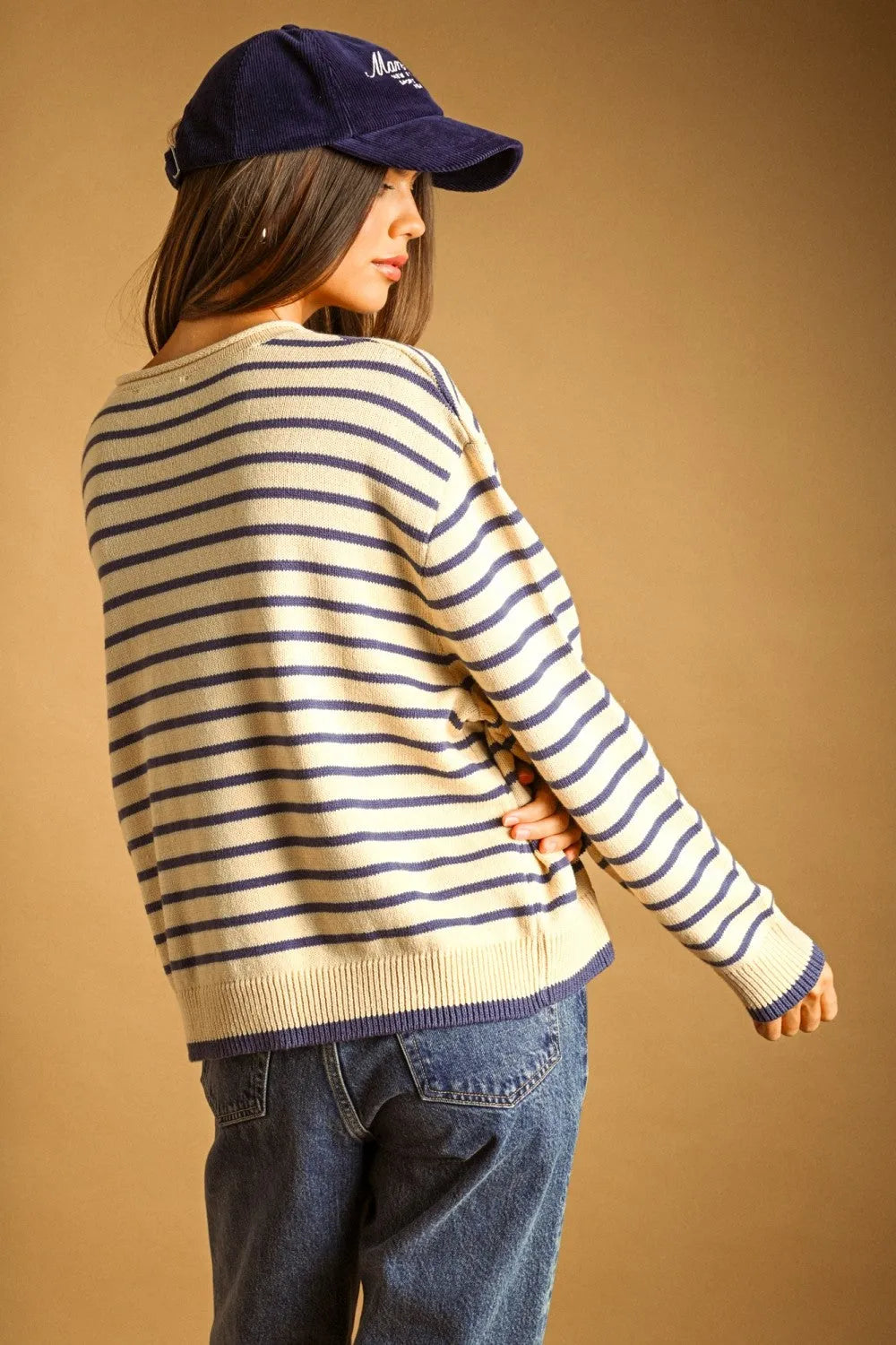 Navy and cream striped long sleeve knit sweater with ribbed cuffs and hem in a classic striped long sleeve design