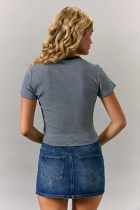 A navy and white striped short sleeve round neck crop top with a black ribbed crew neckline