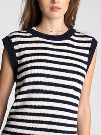 A navy and white striped knit sleeveless top with a round neckline from supply orta women’s boho chic clothing shop daisy
