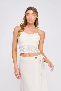 Off-white crochet crop top with fine lace pattern scallop edges and thin spaghetti straps in lace pattern bralette style