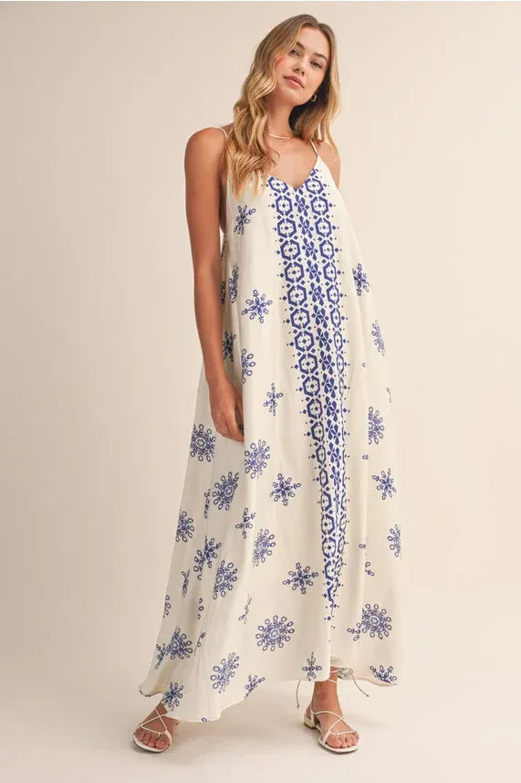 Border printed flowy sleeveless maxi dress with blue floral embroidery