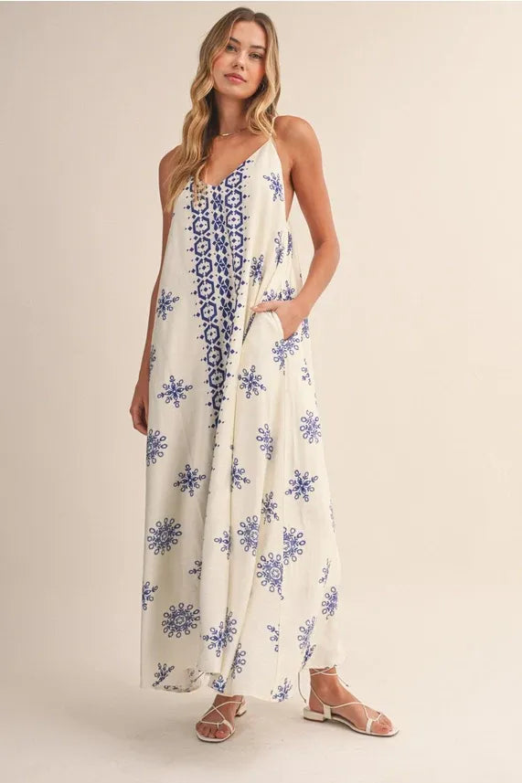 Border printed flowy sleeveless maxi dress in off-white with blue pattern