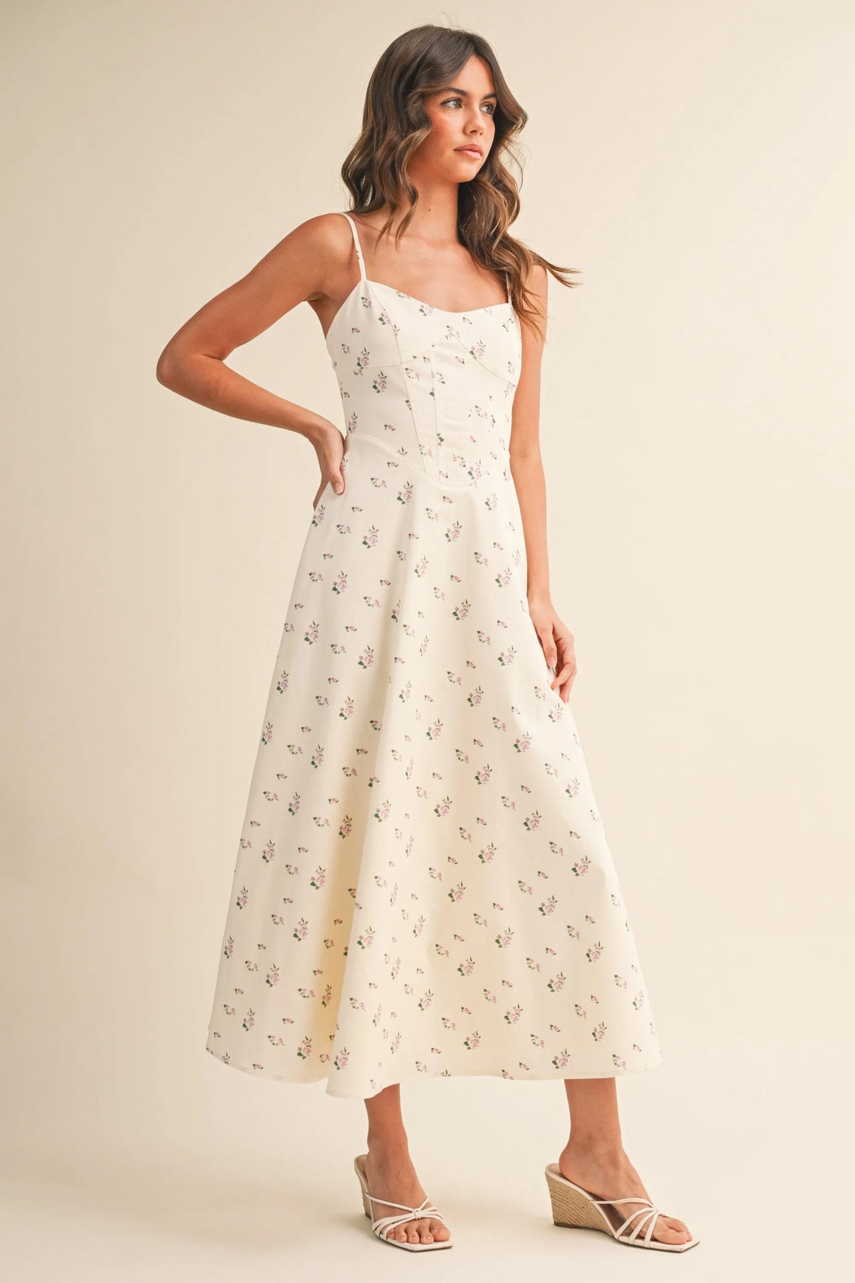 A flowing off-white floral twill paneled midi dress with delicate black floral embroidery along the fabric