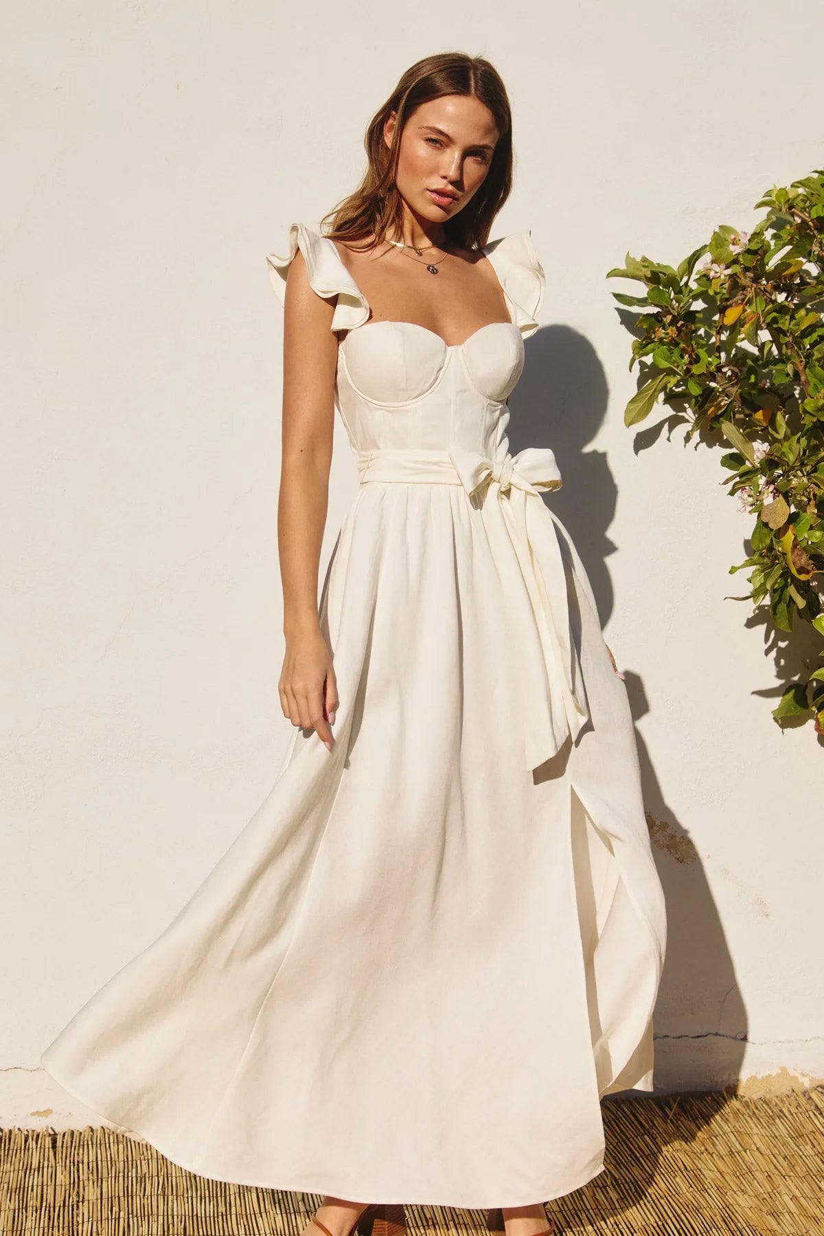 Heaven sent corset flutter dress in off-white satin with ruffled shoulder straps and a cinched waist bow