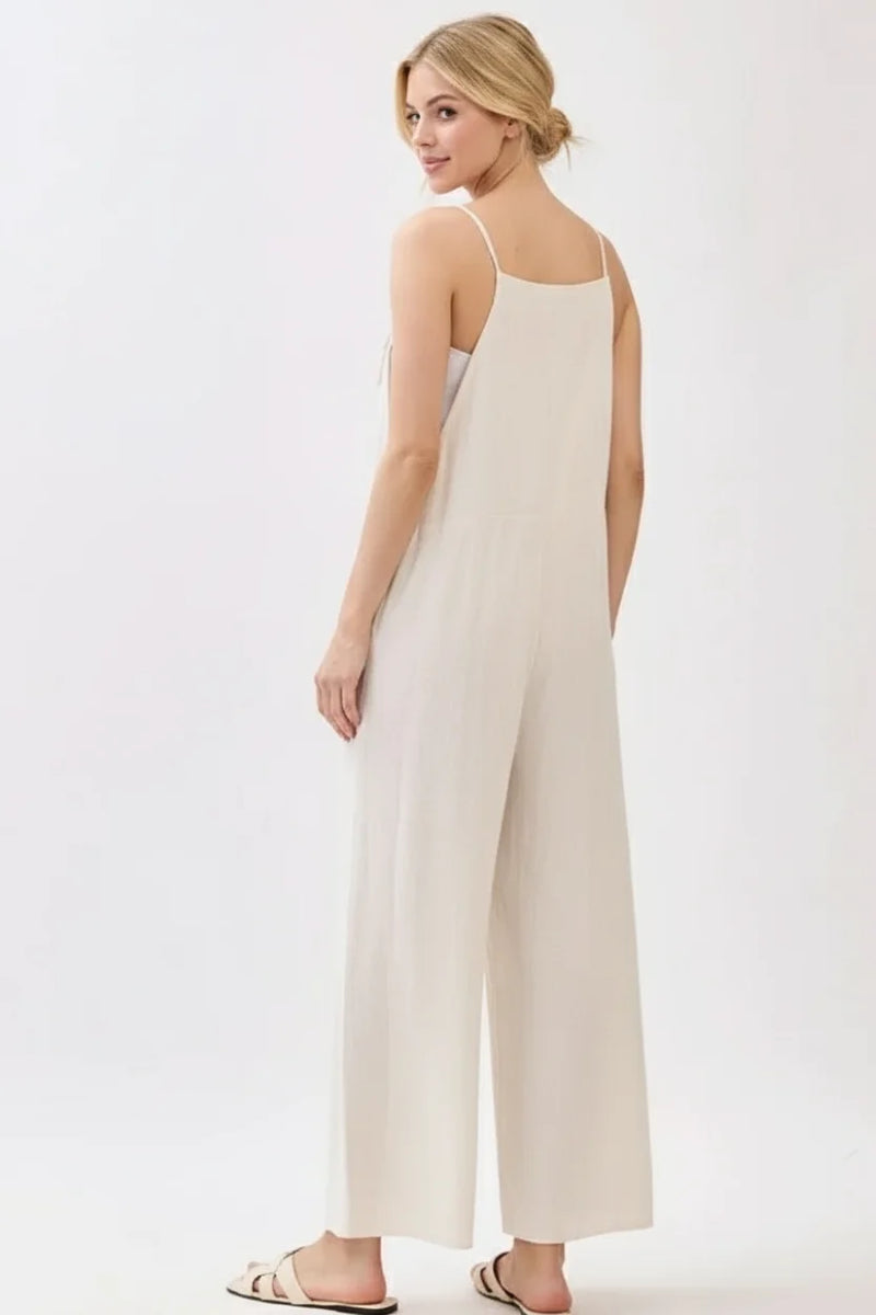 Spaghetti strap wide leg jumpsuit in flowing off-white fabric