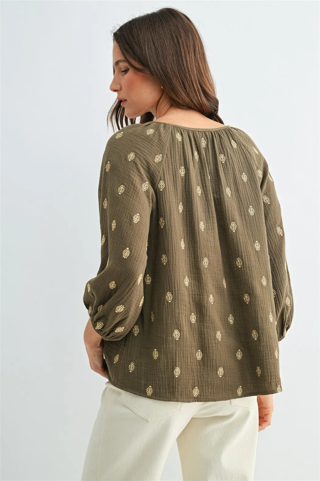 Olive green embroidered gauze 3/4 sleeve blouse with delicate gold floral patterns and gathered neckline for women’s boho chic clothing from shop daisy