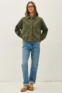 Olive green corduroy cropped shacket with classic collar and two front pockets in button-up design