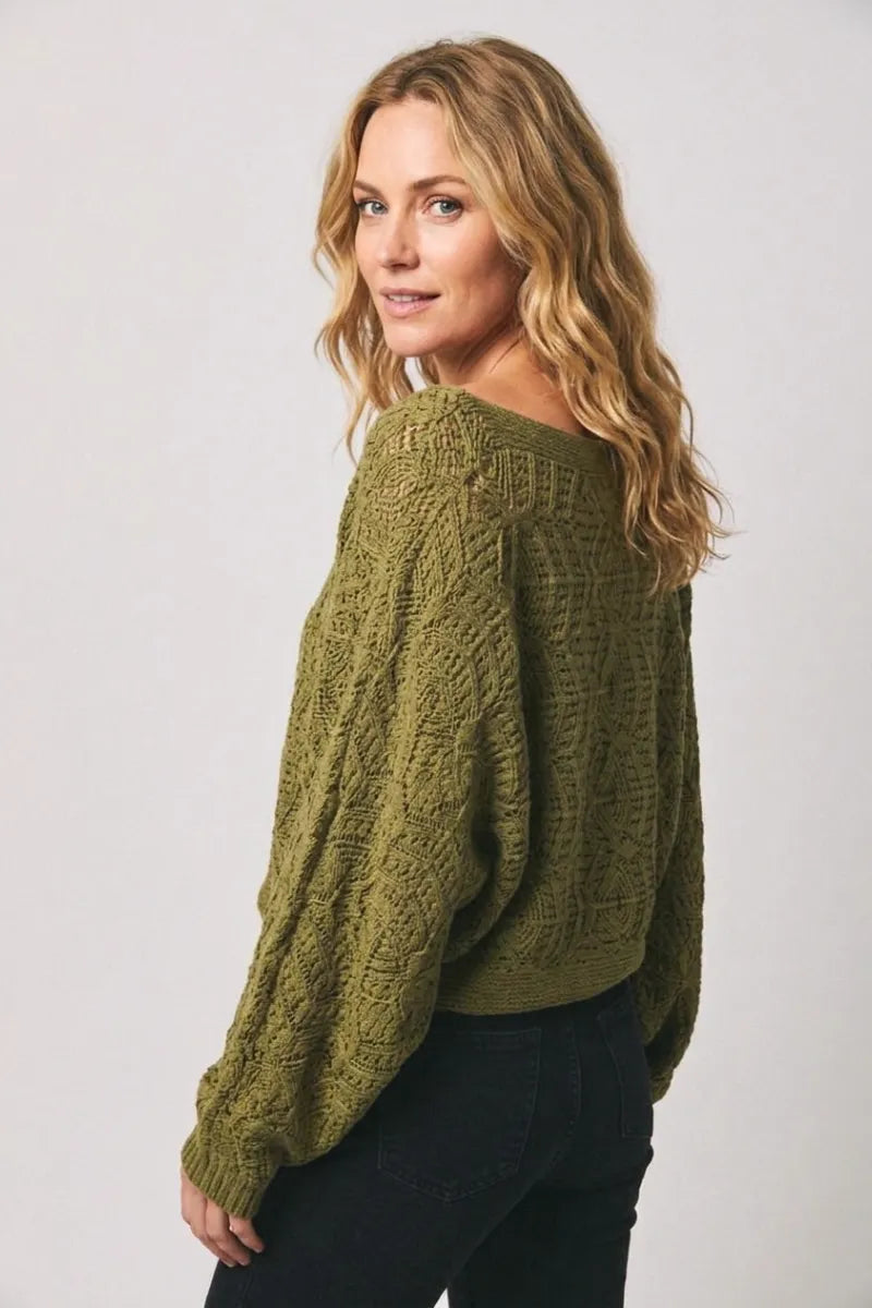 Olive green long sleeve crochet cardigan with cable knit fabric, relaxed fit, and wide sleeves