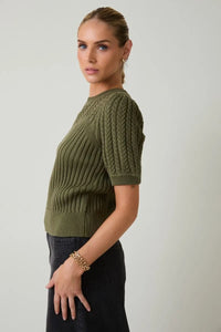 Olive green round neck puff short sleeve cable knit sweater with textured sleeve cable knit design