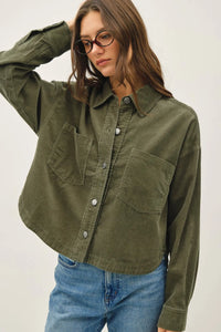 Olive green corduroy cropped shacket with silver buttons and two front pockets in corduroy cropped design