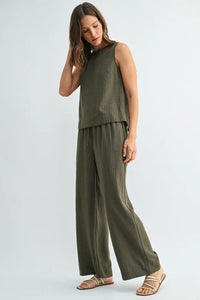 Olive green ribbed knit sleeveless top with matching wide-leg elastic waist tie stripe pants for comfortable wear