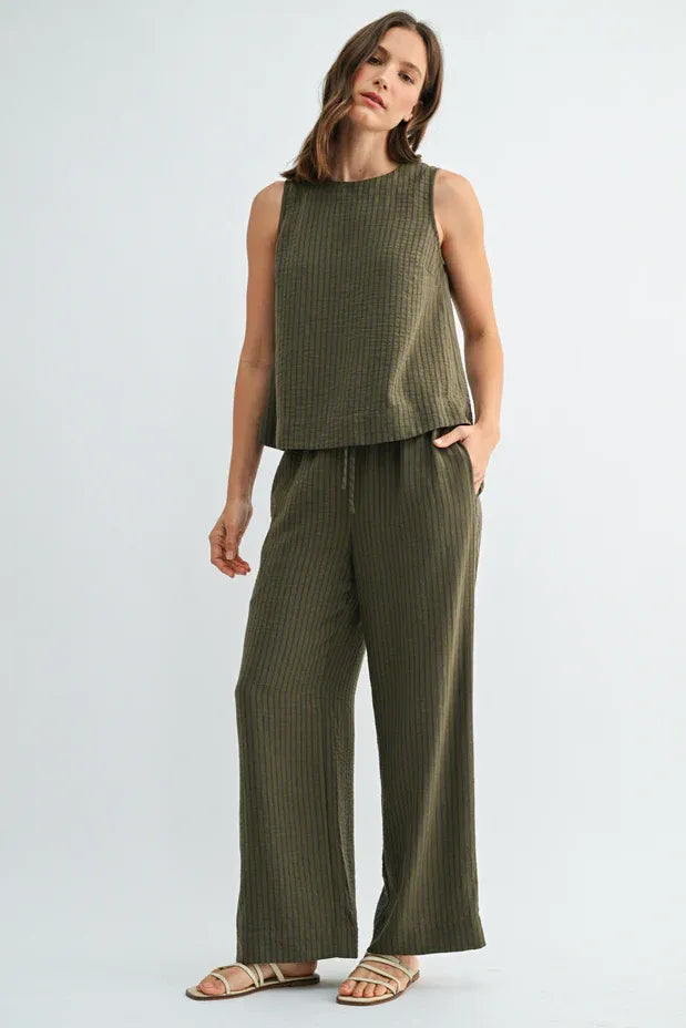 Olive green ribbed linen sleeveless top with matching elastic waist tie wide-leg pants for comfortable wear