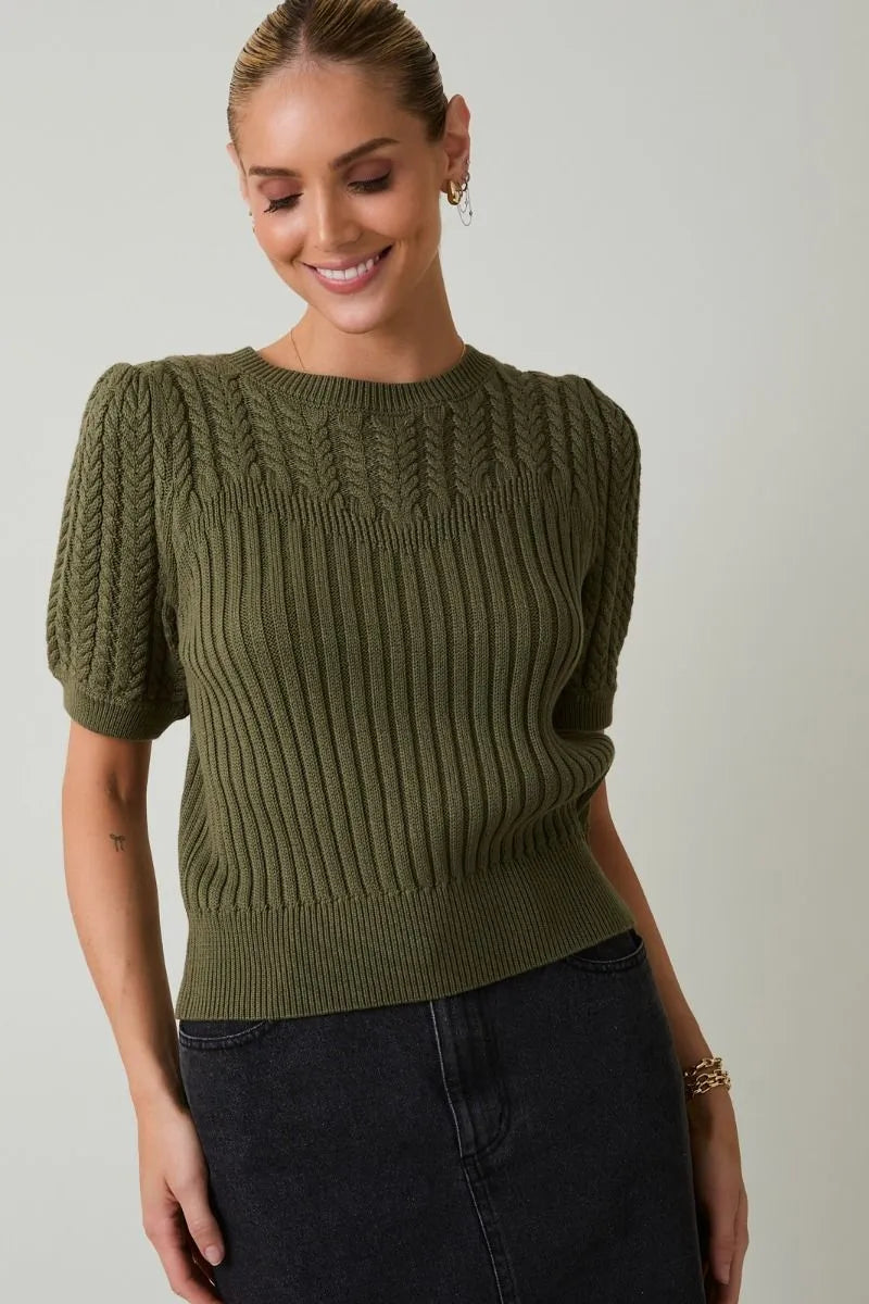 Olive green ribbed knit round neck puff short sleeve sweater with textured cable knit pattern across the chest