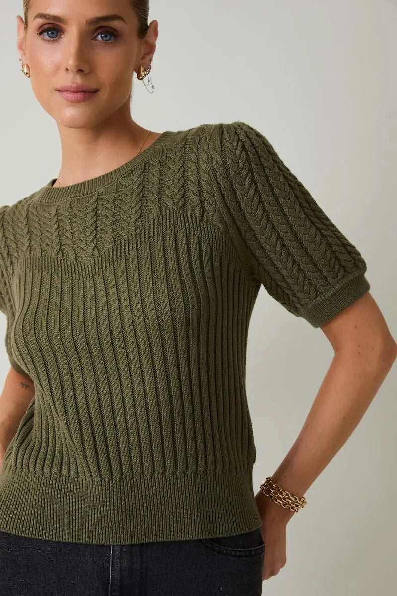 Olive green ribbed knit sweater with round neck puff short sleeve featuring a textured sleeve cable knit pattern